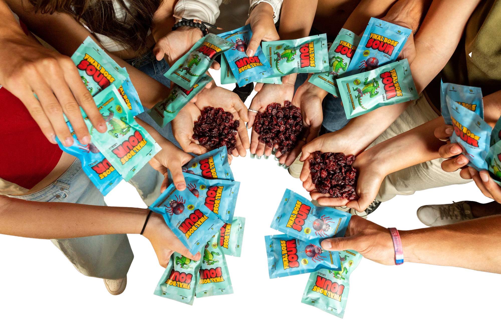 Birds eye view shot of a group of hands holding lots of Final Boss Sour cranberries.